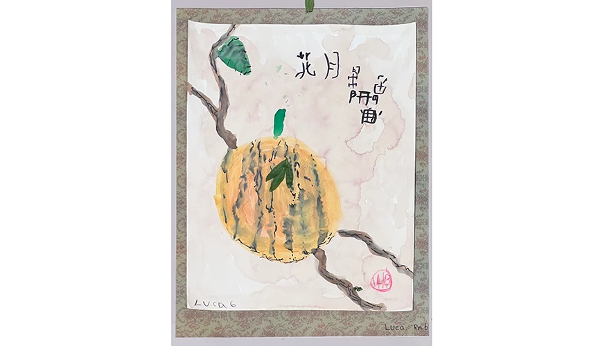 photo of arts and craft work on paper suggesting an orange fruit hanging from a tree branch